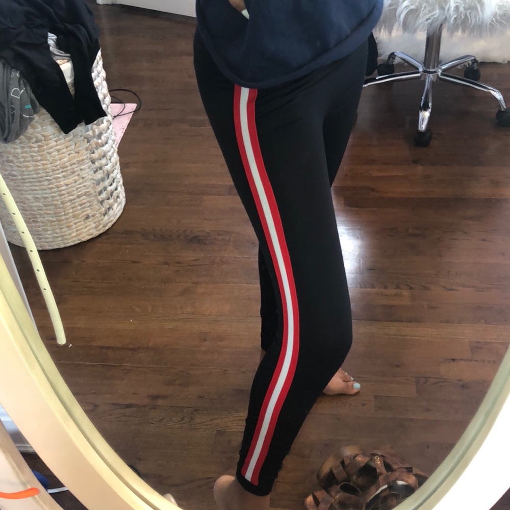 Black leggings with red and white stripes